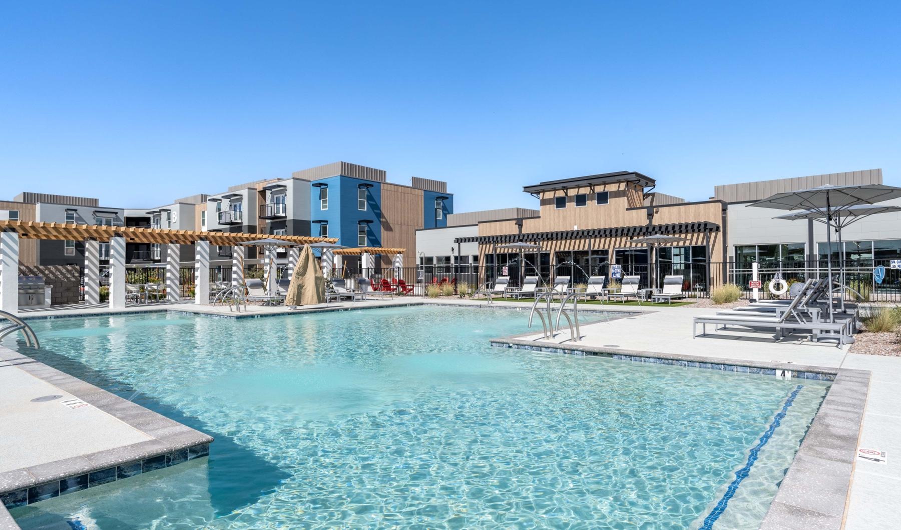 a swimming pool in front of a building