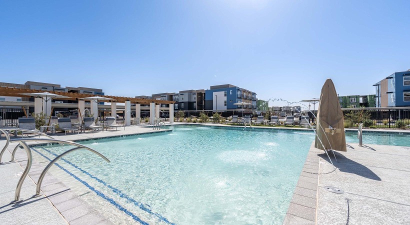 a pool with a building in the background